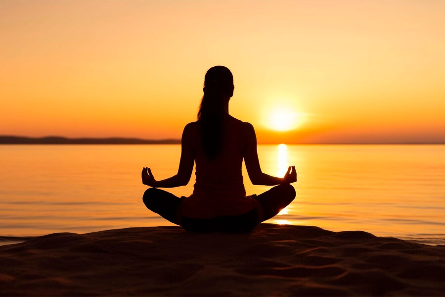 portrait-person-practicing-yoga-beach-sunset_23-2151046782